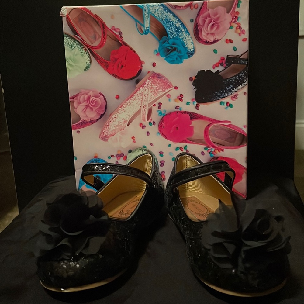 New. Never worn. Girls black glitter dress shoe.